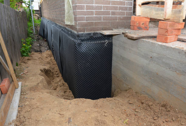 Happy homeowners after waterproofing job in Lovejoy
